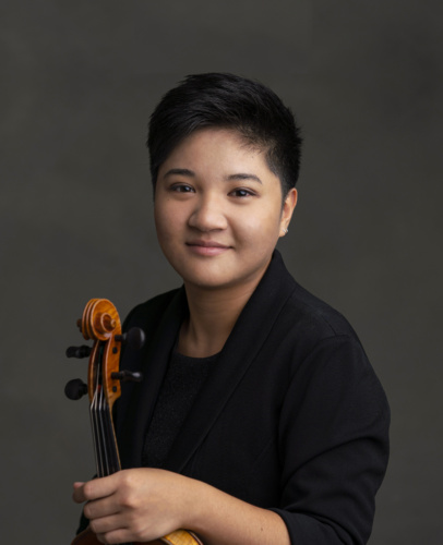 Yuanju holding a violin